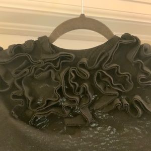 COS Black women’s sweater with Rosette detailing around the bodice.